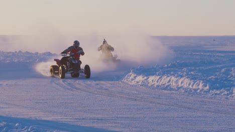 ATV-Four-Wheeler-racers-on-ice-road-turning-corner-in-slow-motion
