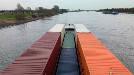 Fixed-Shot-Over-Alfa-Nero-Colorful-Containers-Carrier-Ship-Sailing-In-Zwijndrecht,-Netherlands
