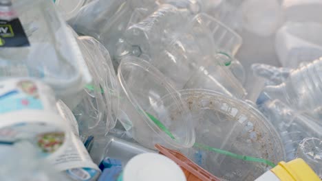 Close-up-of-recycling-containers-in-a-pile