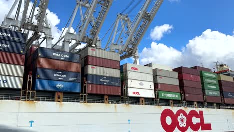 Orient-Overseas-Container-Line-shipping-containers-at-a-terminal-port-in-Seattle---sliding-view
