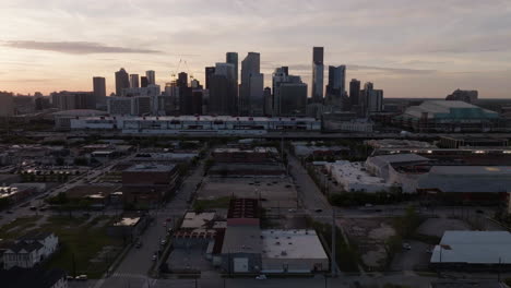 Aerial-view-approaching-the-city-of-Houston-from-the-east-side,-dawn-in-Texas,-USA