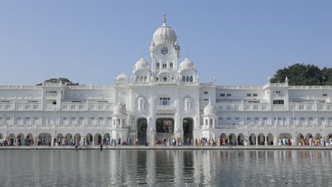 Hundreds-of-people-visiting-the-Golden-Temple,-Sikh-Gurdwara,-Amritsar-Punjab-India