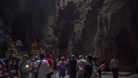 Slow-and-long-tilt-up-over-interior-of-massive-cave-in-Da-Nang,-Vietnam