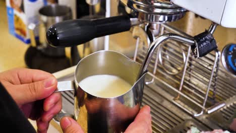 Barista-pour-Cappucino-Latte-art-with-heart-shape-using-sharp-spout-milk-pitcher