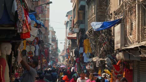 Cityscape-view-of-a-crowded-street-full-of-small-shops-and-markets,-in-Kathmandu,-Nepal