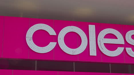Smoothly-panning-shot-highlighting-the-exclusive-logo-of-Coles-store