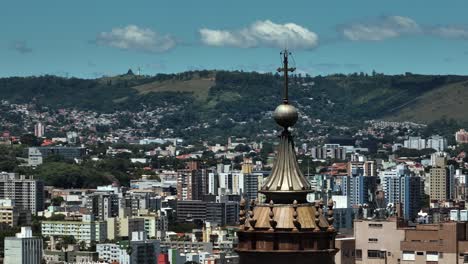 Aerial-parallax-around-the-church-tower-of-Catedral-Metropolitana-de-Porto-Alegre,-in-sunny-Brazil