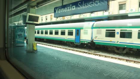 Parked-train-at-the-Santa-Lucia-Train-Station-captured-from-a-window-train-cabin-in-Venice,-Italy