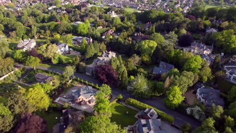 Drone-flight-over-luxury-houses-located-in-Alderley-edge,-Cheshire,-UK,-Europe