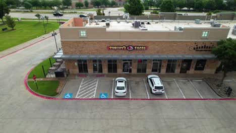 Editorial-aerial-footage-of-Torchy's-Tacos-in-Highland-Village-Texas-located-at-1601-Village-Pkwy-Ste-K110,-Highland-Village,-TX-75077