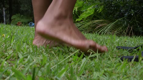 Feet-Up-Close-Walking-on-Soft-Green-Grass-Away-From-Camera