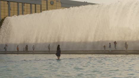 Woman-standing-inside-by-fountains-in-the-center-of-Tashkent-on-independence-square