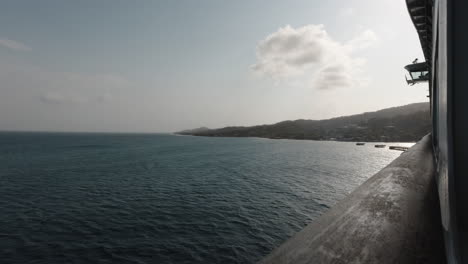 Roatan,-Honduras-as-seen-from-the-balcony-of-a-cruise-ship-in-the-evening