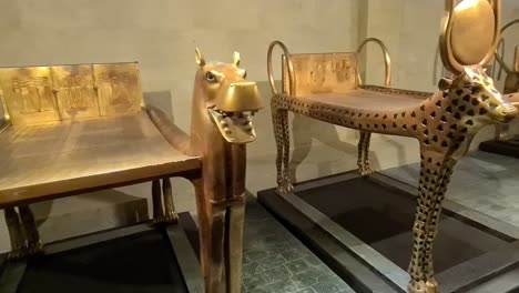 Pan-shot-of-Egyptian-art-golden-beds-for-dead