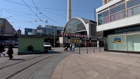 A-static-shot-of-people-going-about-their-day-at-the-Alexanderplatz,-a-central-square-on-the-eastern-city-centre-of-Berlin,-Germany