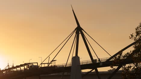 Morning-medium-view-of-the-Goodwill-Bridge,-Brisbane-City-at-sunrise-from-Southbank