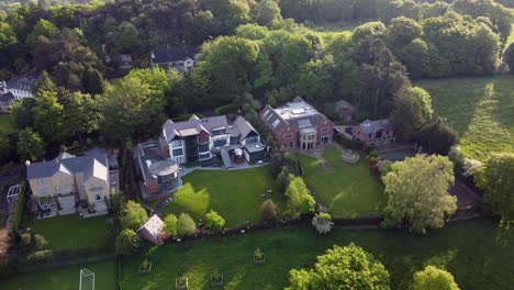 Drone-flight-over-luxury-houses-located-in-Alderley-edge,-Cheshire,-UK,-Europe