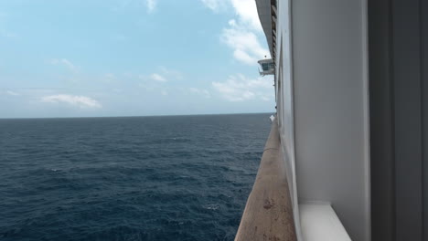 The-side-of-a-cruise-ship-as-it-sails-handheld