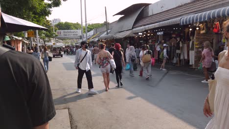 Walking-Shot-Inside-the-Main-Alley-of-Chatuchak-Market,-Many-tourists-and-locals-Wondering-Around,-Bangkok-Thailand