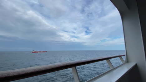 An-oil-tanker-sailing-as-seen-from-the-Balcony-of-a-cruise-ship-slow-motion