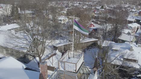 Drone-shot-of-Corporation-flag-Liviensis-on-background-we-can-see-Tähtvere-district-180-degree-shot