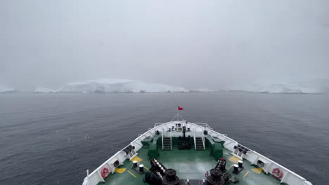 Static-view-over-the-bow-onboard-expedition-ship-MS-EXPEDITION-at-Melchior-Islands-in-Antarctic-Peninsula