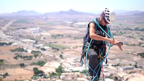 Murcia,-Spain,-May-20,-2023:-Via-ferrata-ascension-by-group-of-sportsmen-drone-aerial-view-of-mountain-and-mountaineers-climbing-in-Alicante,-Spain