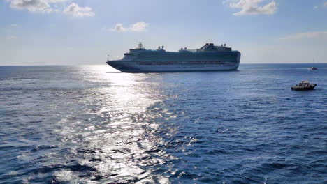 Against-the-backdrop-of-the-setting-sun,-the-cruise-ship-creates-a-stunning-contrast,-its-elegant-form-painted-in-the-hues-of-twilight