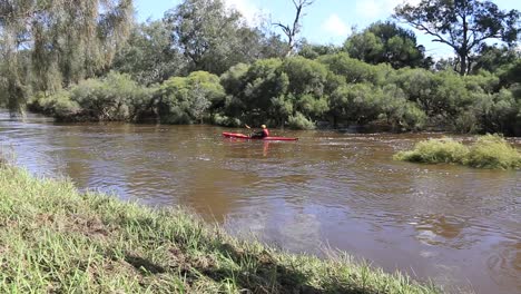 Single-Lone-Kayaker-Paddling-In-the-Avon-Descent-Boat-Race,-Perth-Australia