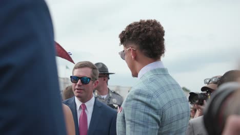 Andy-Beshear-and-Patrick-Mahomes-talking-before-Kentucky-Derby-in-paddock