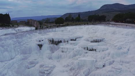 Drone-pull-shot-of-the-travertine-terraces-geothermal-attraction-Pamukkale