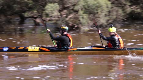 Double-Kayak-Competitors-In-The-Avon-Descent-Boat-Race-Racing-Down-the-Swan-River,-Perth