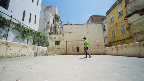 Young-Boys-Playing-Soccer-Under-The-Sun-In-Casbah-of-Algiers,-Algeria