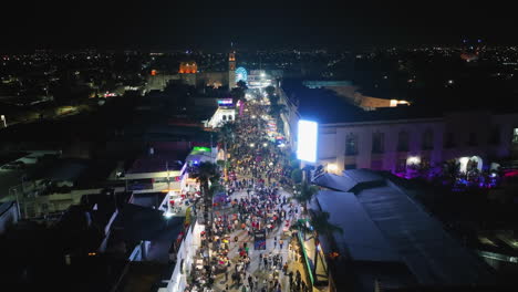 Aerial-view-over-the-Feria-Nacional-de-San-Marcos-fair,-night-in-Aguascalientes,-Mexico