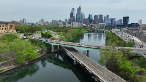 Aerial-drone-shot-follows-Schuylkill-River-past-Philadelphia-Museum-of-Art-and-towards-bustling-city-center