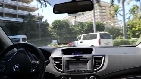Inside-view-car-of-taxi-driver-arriving-to-luxurious-hotel-in-tropical-country