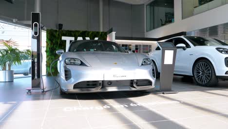 The-car-dealership-exhibition-features-a-display-of-two-white-vehicles