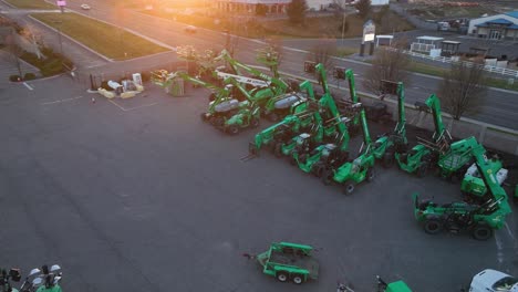 Aerial-view-of-a-heavy-machinery-rental-yard-at-sunset