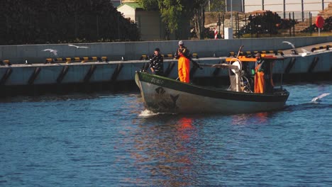 Fishermen-go-by-boat-in-the-port