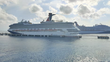 Capturing-a-breathtaking-view-of-two-Carnival-cruise-ships-docked-at-the-port-|-Two-luxury-cruise-ships-of-Carnival-cruise-liner-on-same-port-in-Mexico-|-Carnival-cruise-ship-sailing-from-port