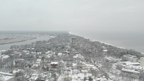 drone-shot-of-snowy-jurmala-from-air-on-background-you-can-see-baltic-sea-and-Babītes-ezers