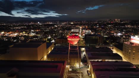 Close-up-of-Sony-Pictures-Water-Tower-at-movie-studio-in-Culver-city,-lit-up-at-night,-Los-Angeles