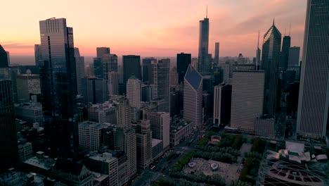Aerial-sunset-view-of-downtown-Chicago-and-Cloud-Gate-Millenium-Park,-Chicago
