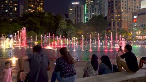 Crowd-of-people-watching-famous-light-water-show-at-KLCC-in-Kuala-Lumpur