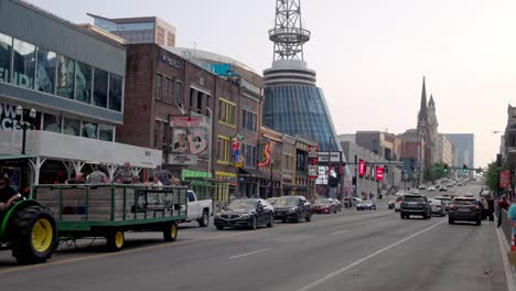 Broadway-Street-in-downtown-Nashville,-Tennessee-showing-traffic-with-gimbal-video-stable