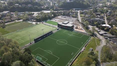 Aerial-Tilt-Shot-of-Football-Pitch-in-Nesttun