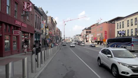 Broadway-Street-in-downtown-Nashville,-Tennessee-with-gimbal-video-panning-left-to-right