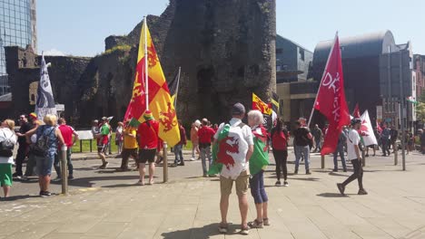 A-man-and-woman-watching-a-Welsh-Independence-rally-in-Swansea