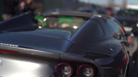 Parallax-shot-of-a-black-Ferrari-rear-end