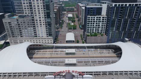 Aerial-tilt-down-shot-of-Union-Station-train-tracks-with-open-roof